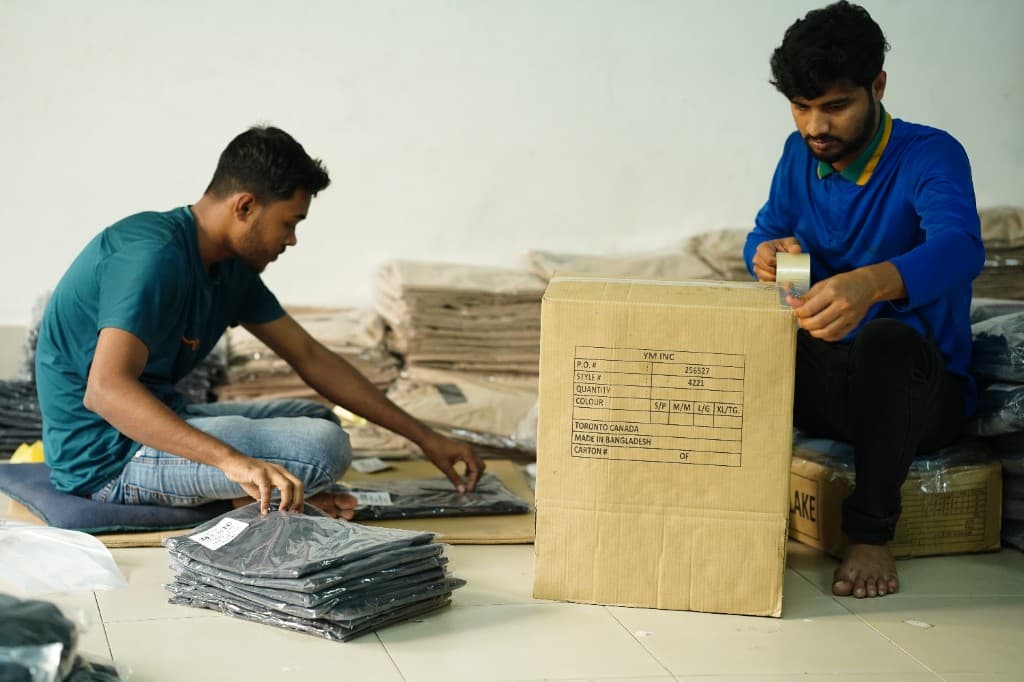 Workers packing garments for export shipment